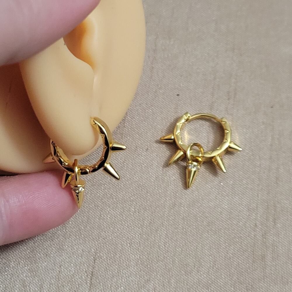 Gold tone spiked mini hoop earrings with dangling spike charm